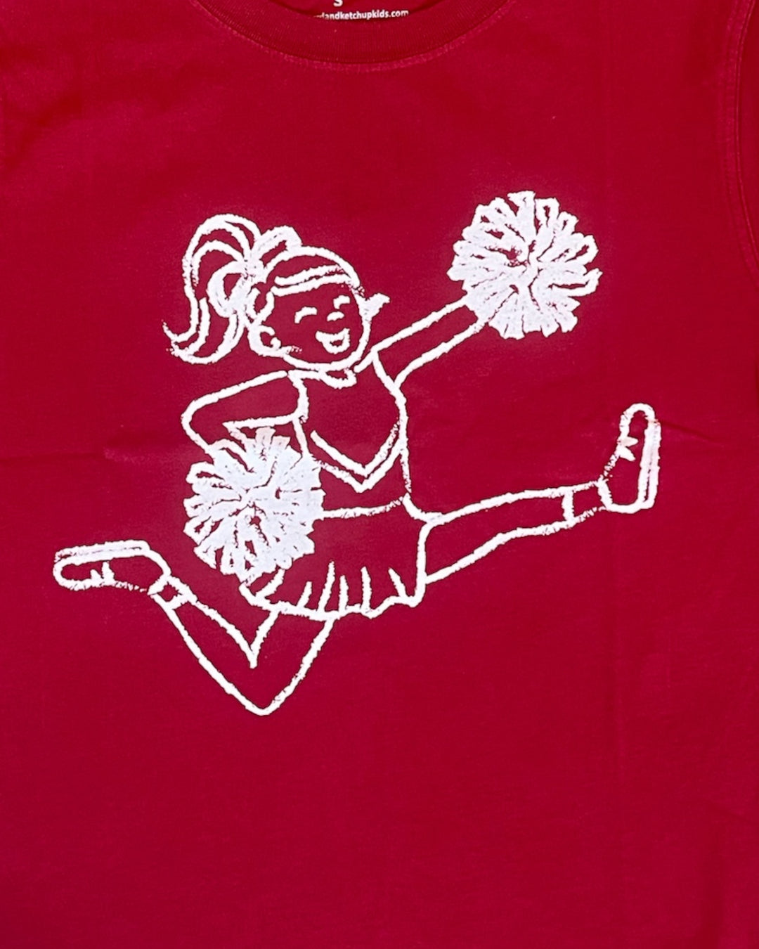 Crimosn shirt with white graphic of a cheerleader