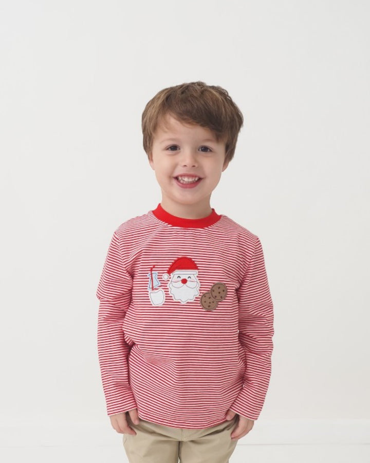 Child wearing a red and white striped sweater with a Santa Claus design on a white background