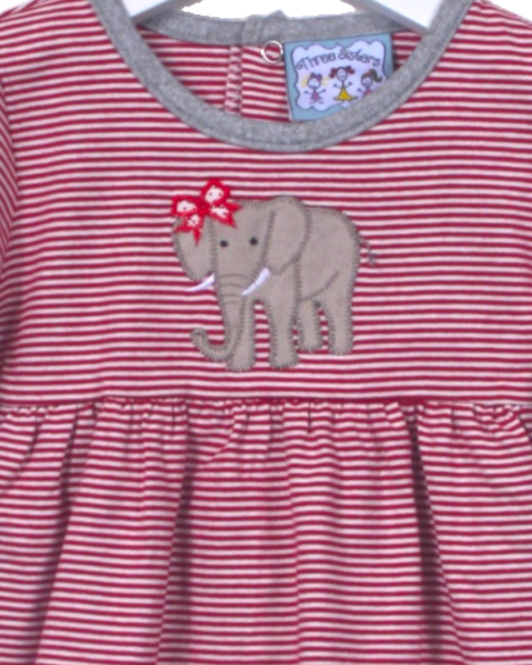 Red and white striped dress with an elephant applique on a hanger