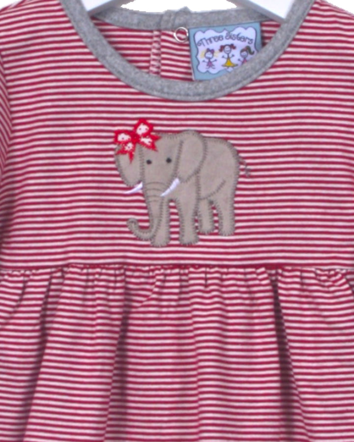 Red and white striped dress with an elephant applique on a hanger