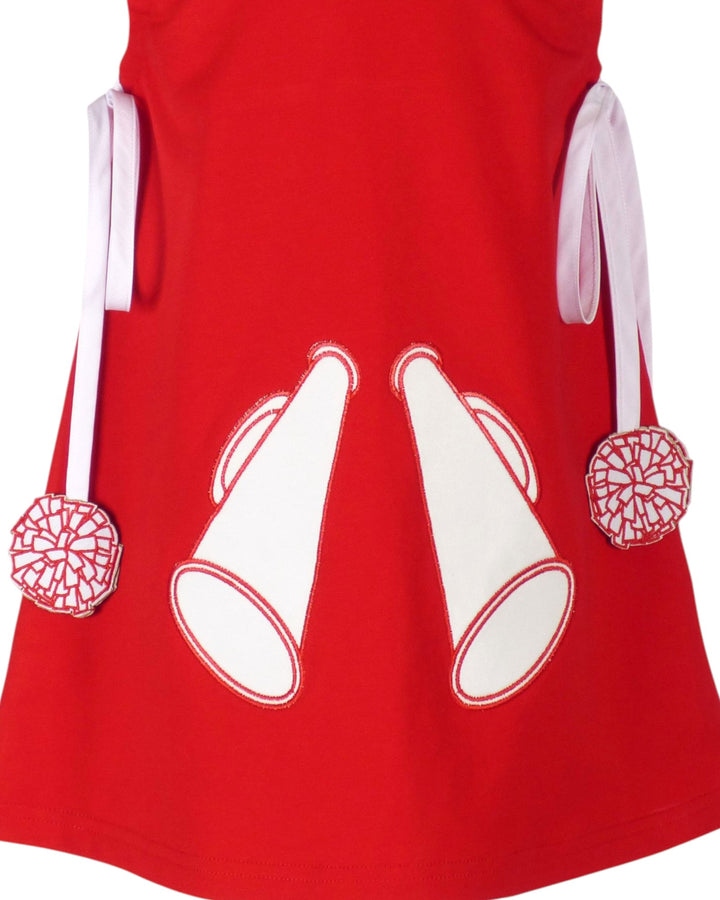 Red dress with white megaphone and pom-pom designs on a white background