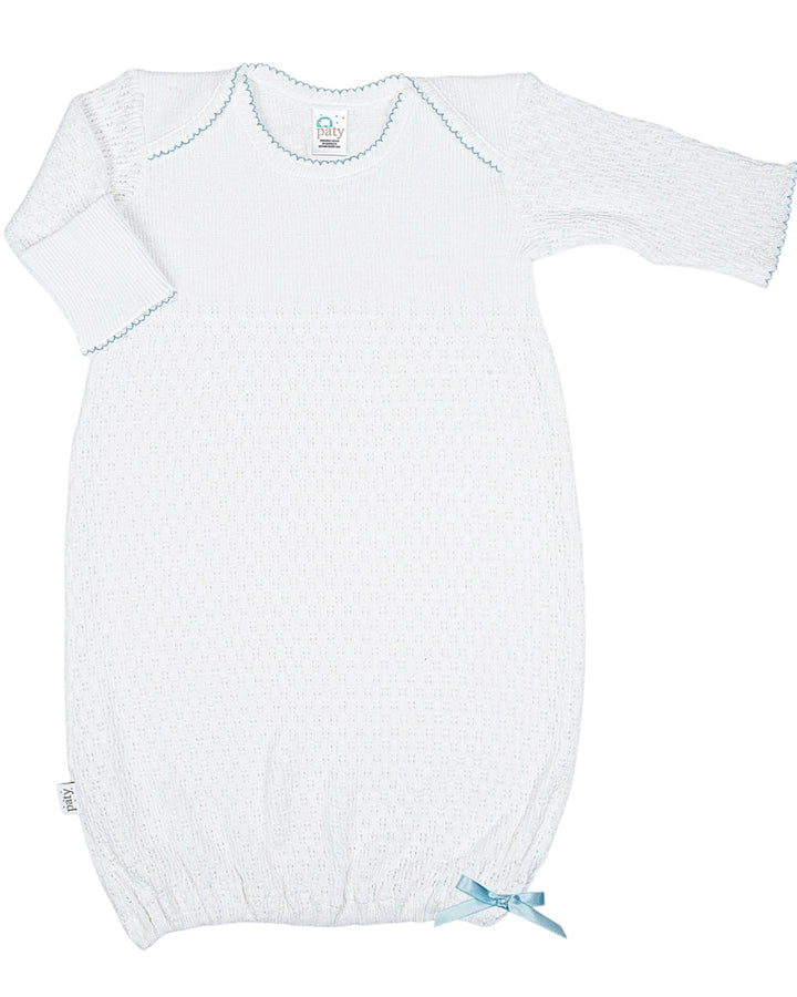 White baby gown with blue trim on a white background
