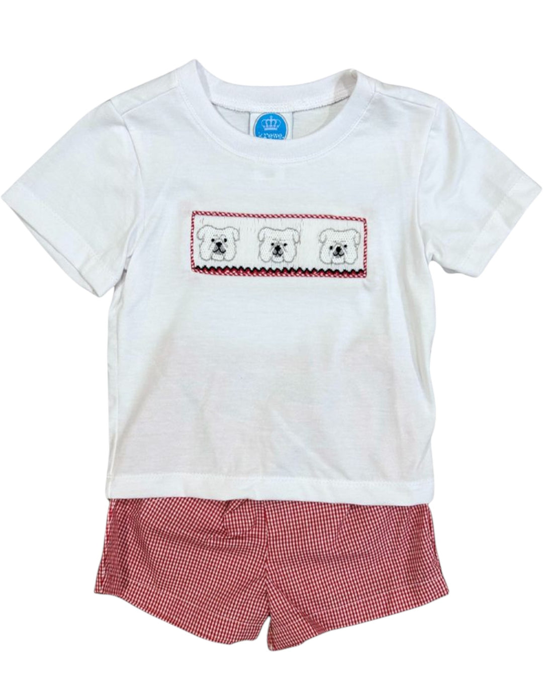 White t-shirt with teddy bear design and red checkered shorts on a white background