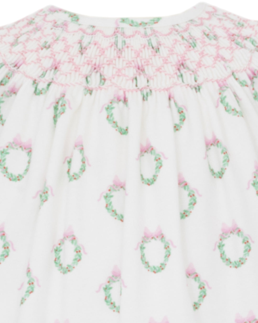 Floral patterned fabric with pink and green flowers on a white background