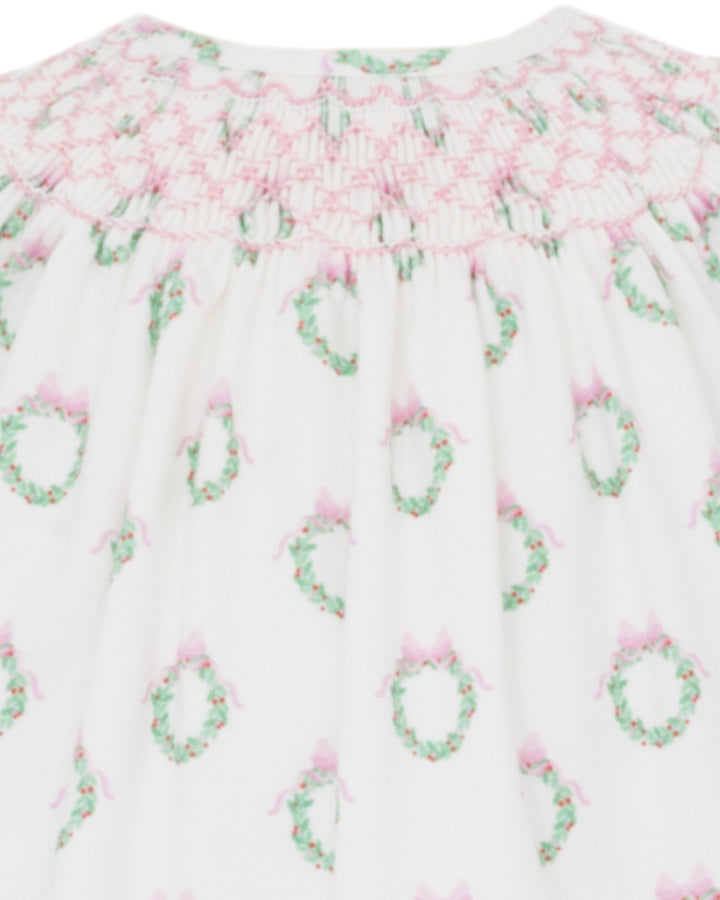 Floral patterned fabric with pink and green flowers on a white background