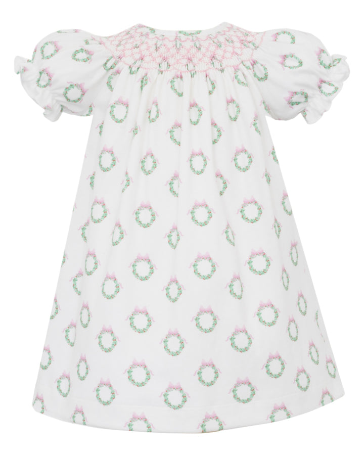 Baby dress with floral pattern on a white background