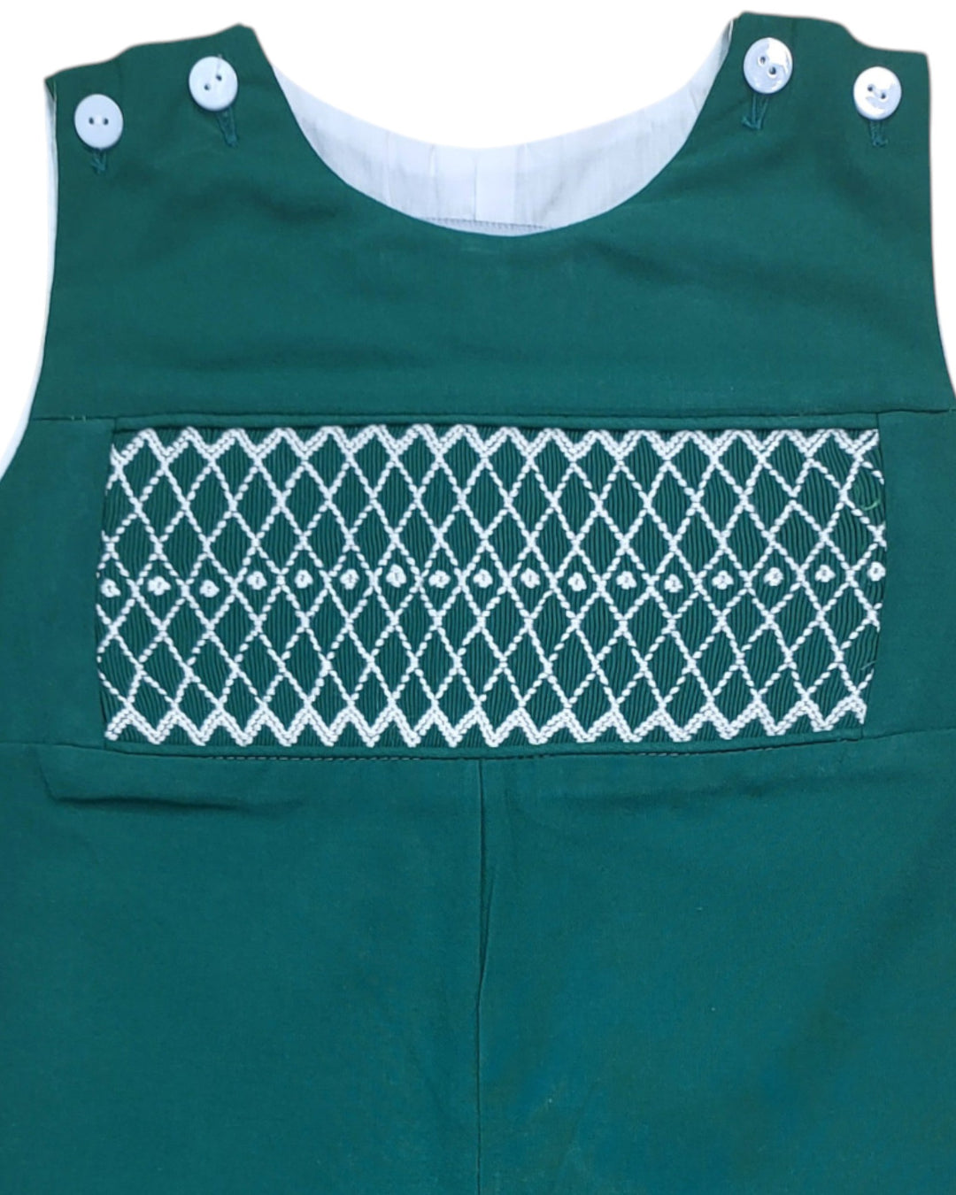 Green children's romper with white lattice pattern on a white background