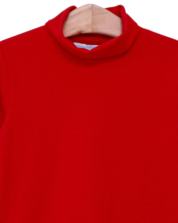 Red sweater on a wooden hanger against a white background