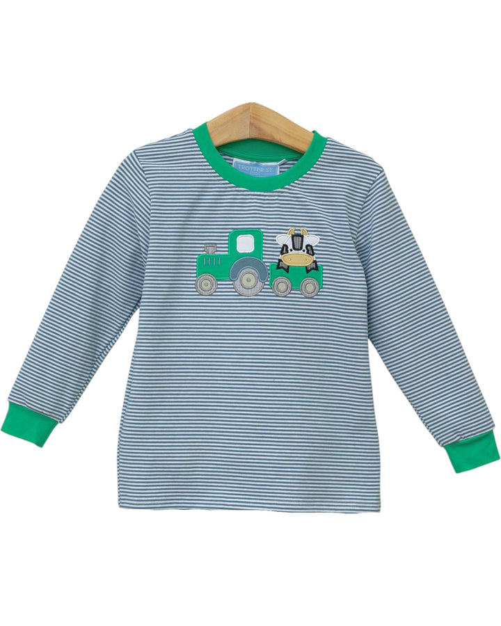 Children's dress with a green train applique on a white background