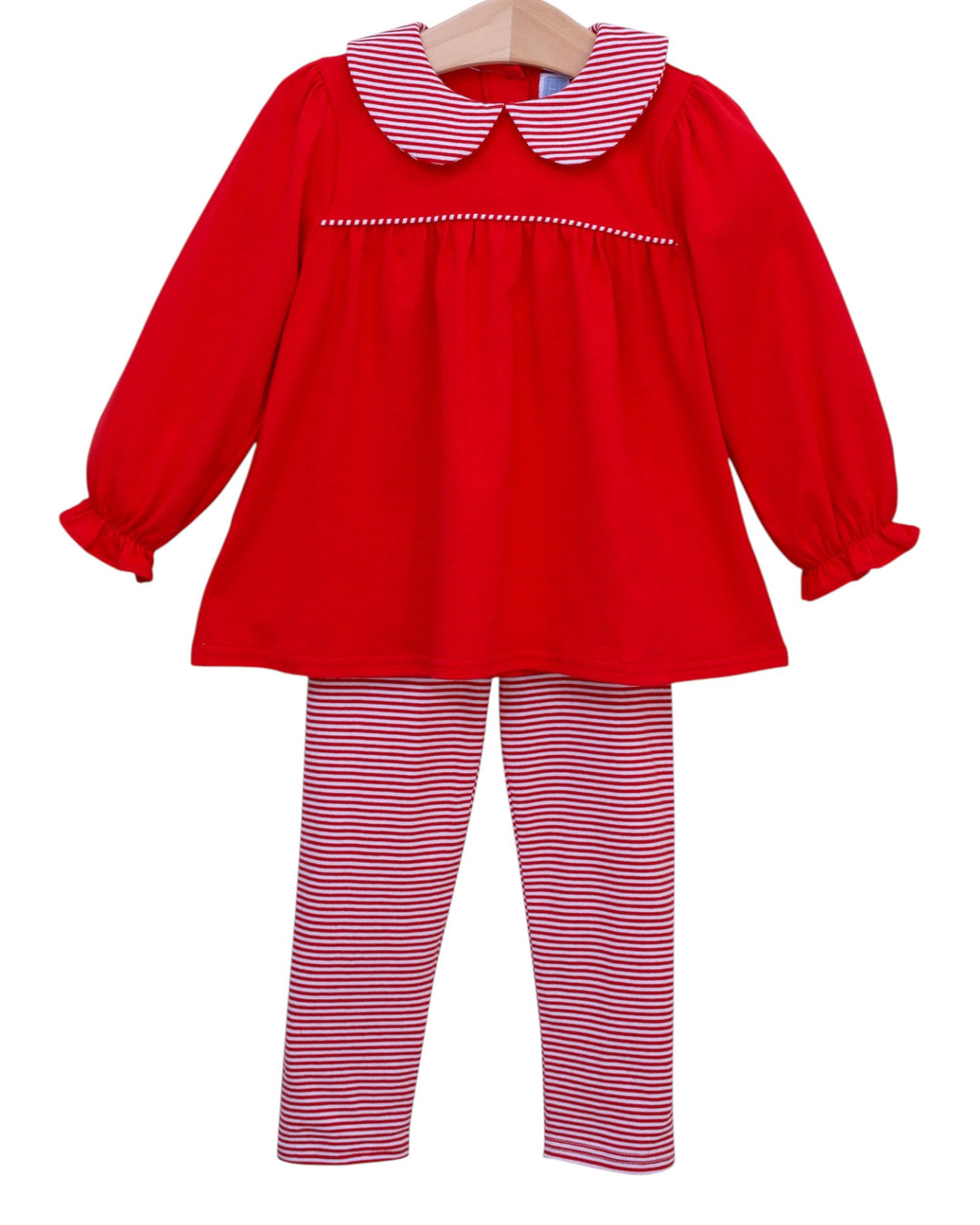 Red dress with a white collar and matching striped leggings on a white background