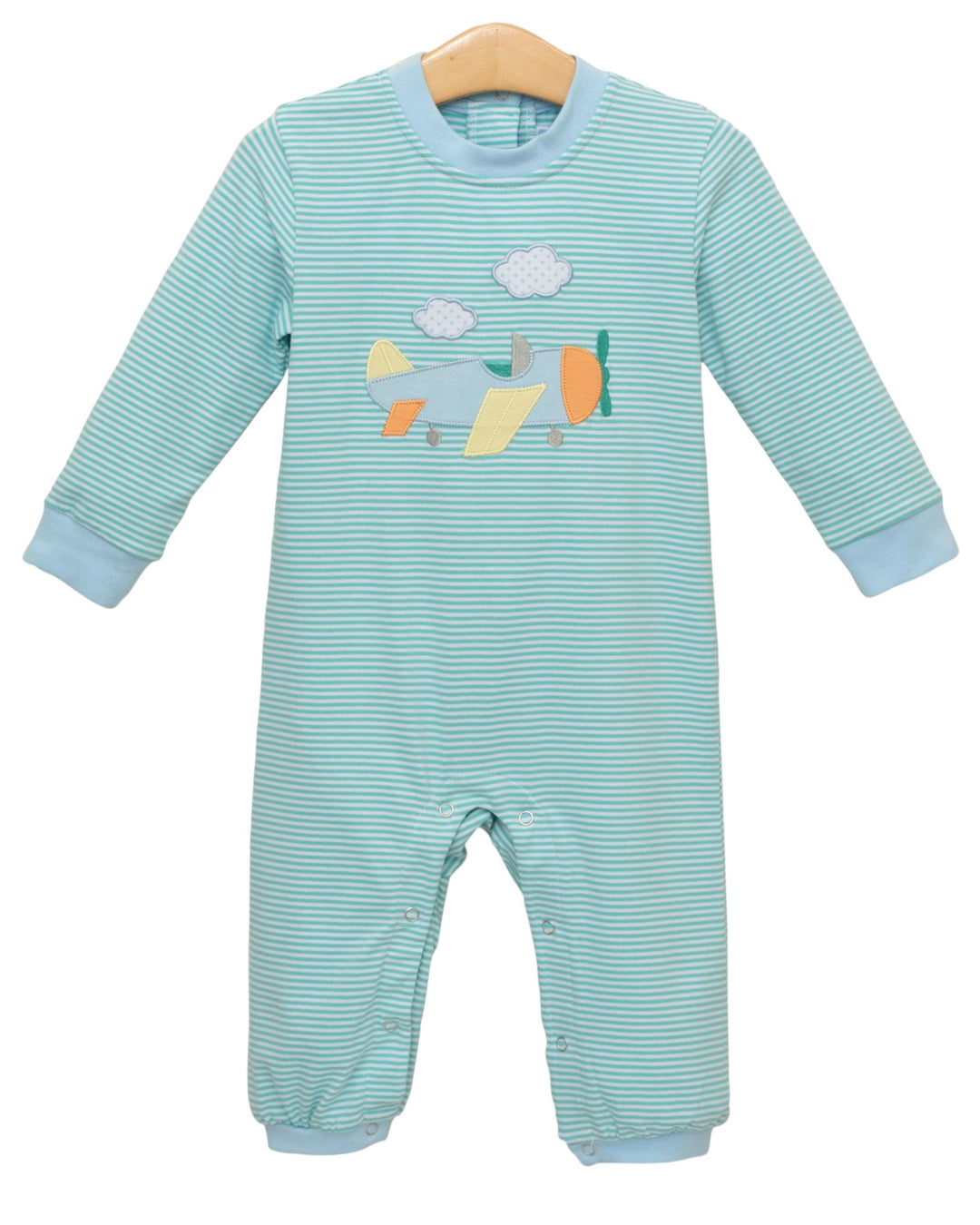 Striped baby onesie with airplane design on a white background
