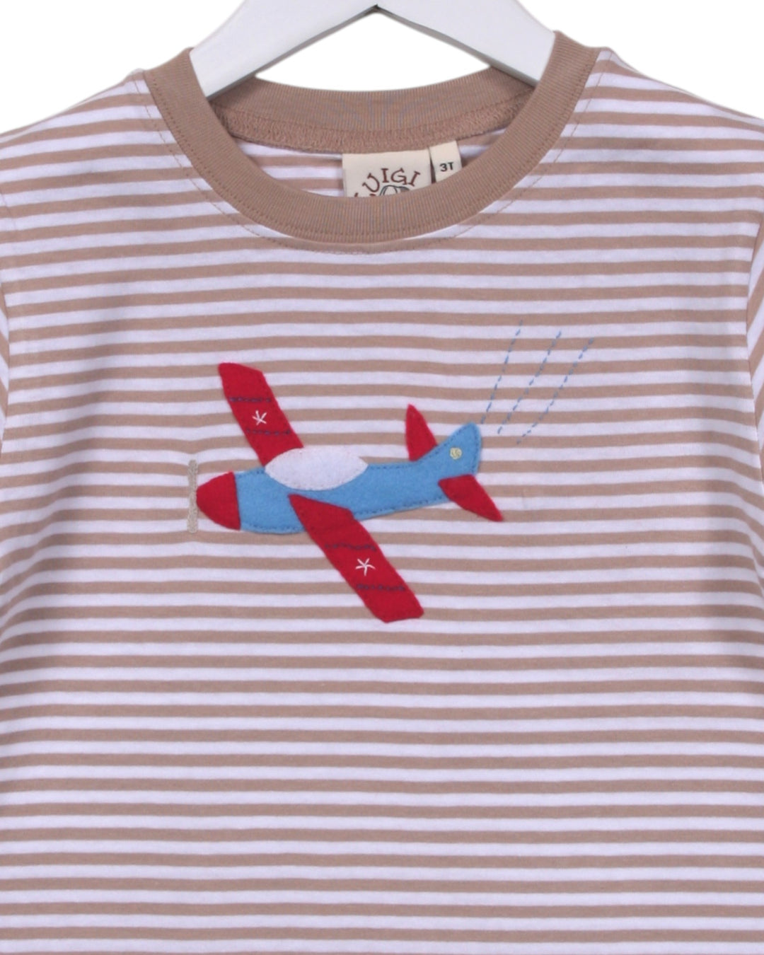 Striped shirt with airplane design on a hanger