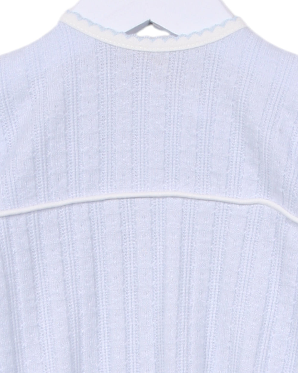 Light blue textured shirt on a hanger with a white background