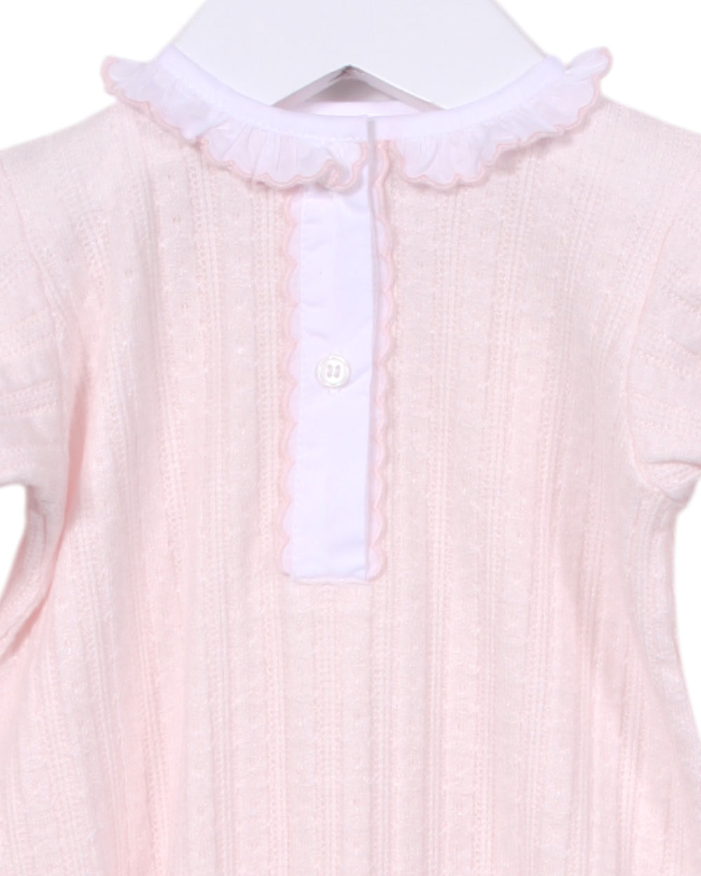 Pink baby outfit with white collar on a hanger