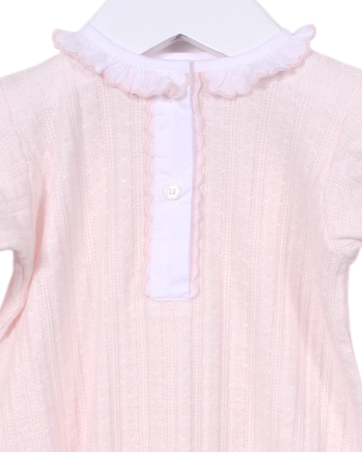 Pink baby outfit with white collar on a hanger