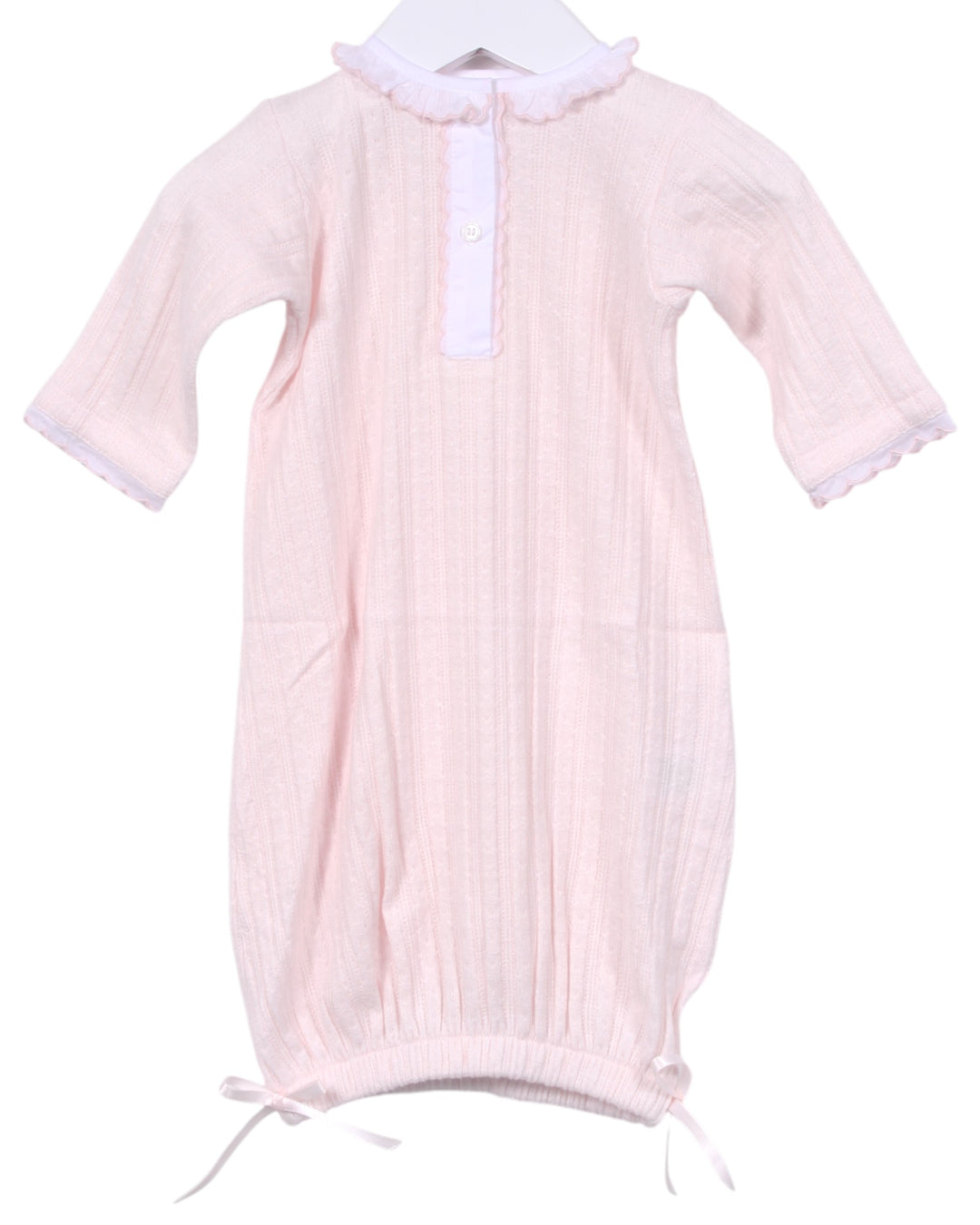 Pink baby gown with white collar on a white background