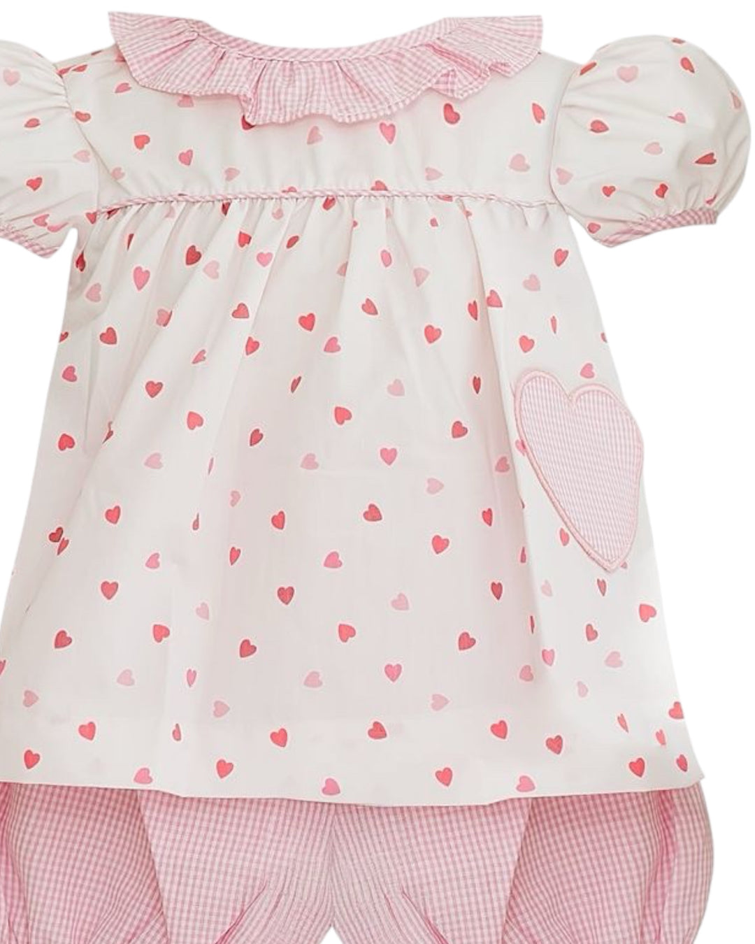 Baby outfit with pink heart pattern on a white background