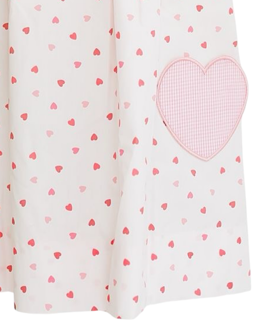 Fabric with heart pattern and a larger pink heart patch on a white background