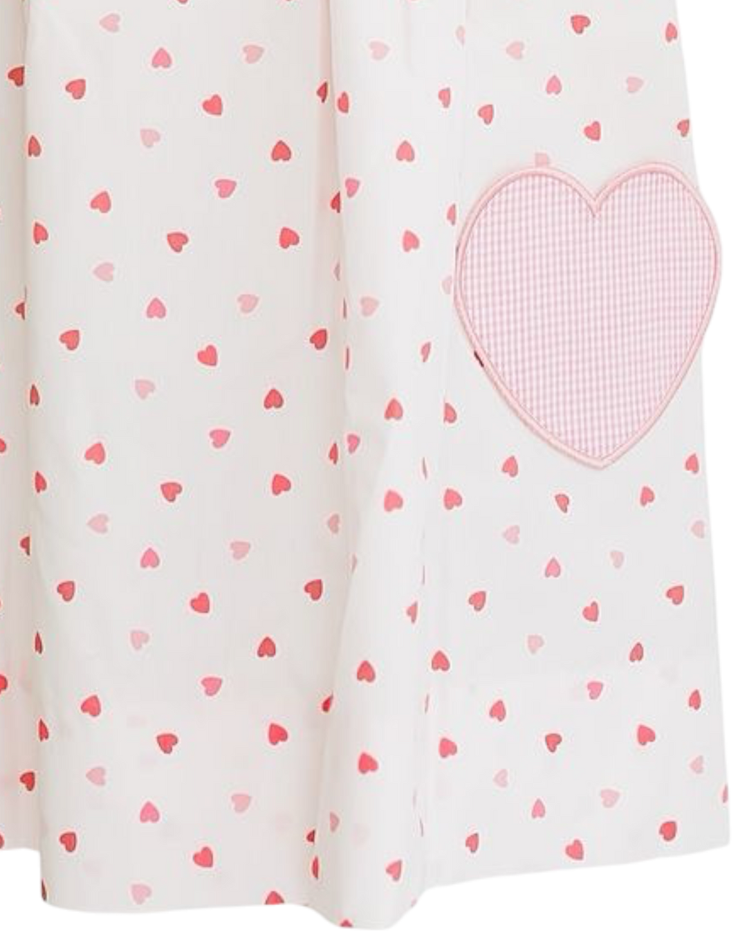 Fabric with heart pattern and a larger pink heart patch on a white background