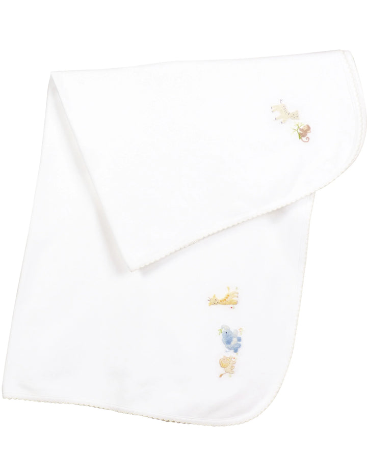 White baby blanket with embroidered designs on a white background