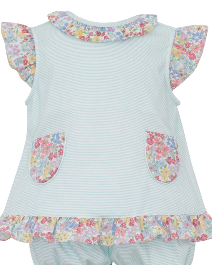 Light blue dress with floral details on a white background