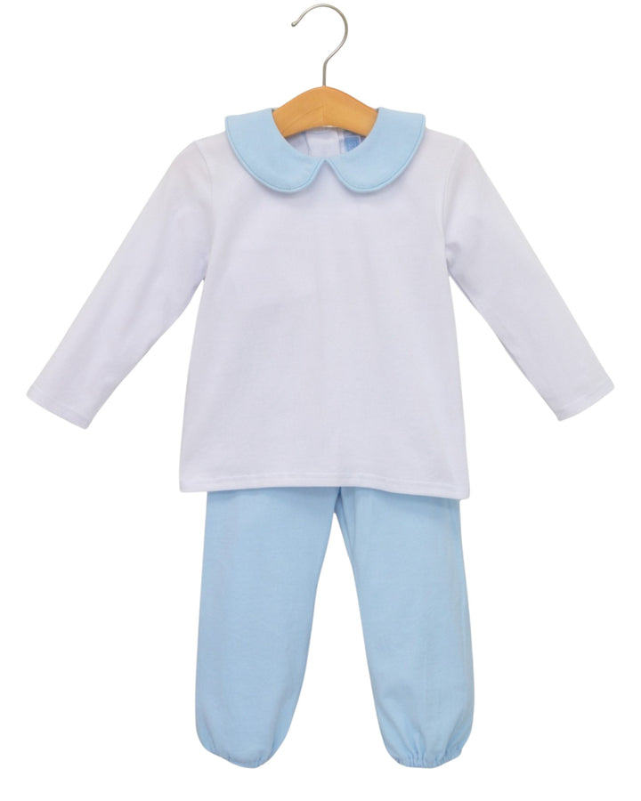 A baby two-piece outfit consisting of a white long-sleeve top with a light blue Peter Pan collar and matching light blue footed pants, hanging on a wooden hanger against a white background, that store