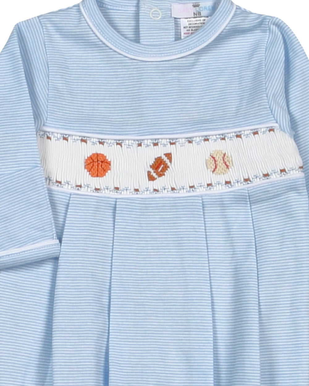 Light blue dress with a decorative white band featuring orange and brown patterns on a plain background.