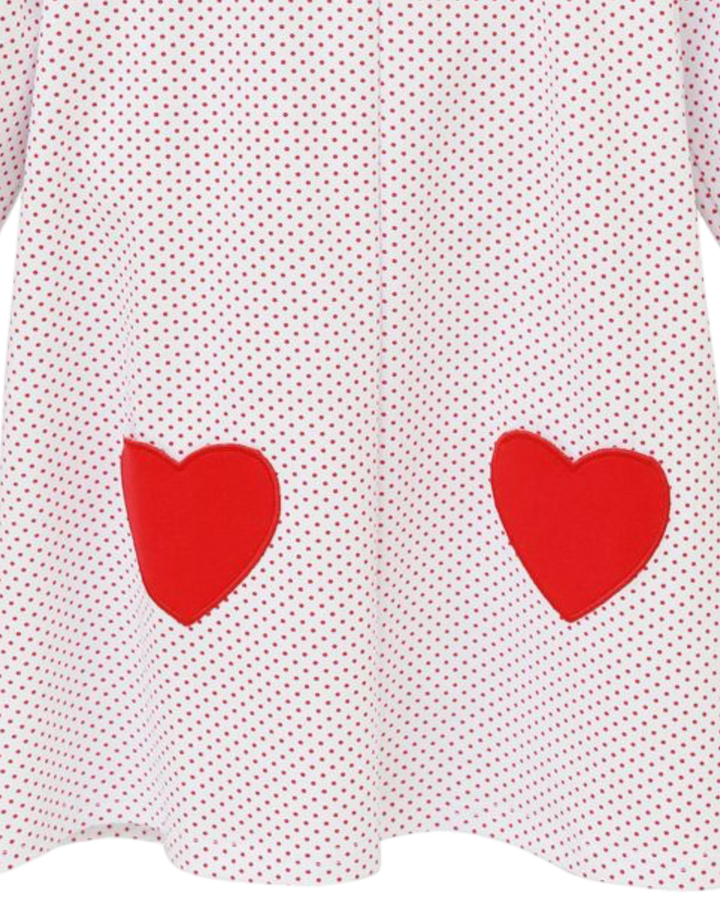 White dress with red heart patterns on a white background