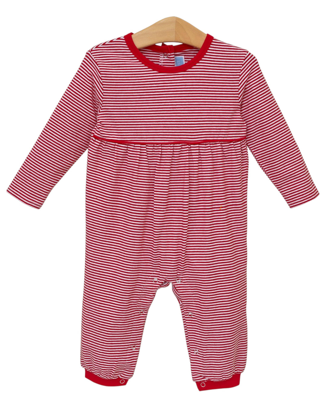 Red and white striped baby romper on a hanger against a white background