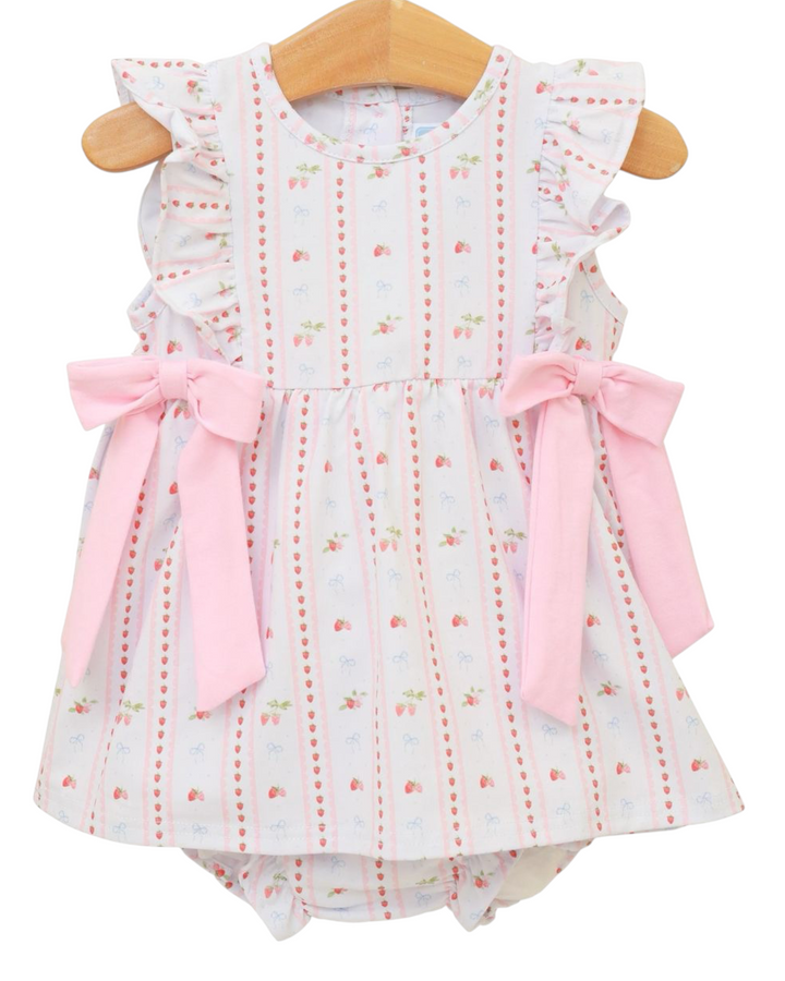 Baby romper with floral pattern and pink bows on a white background