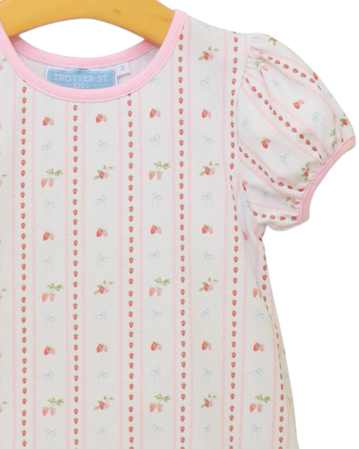 Children's dress with floral pattern on a hanger