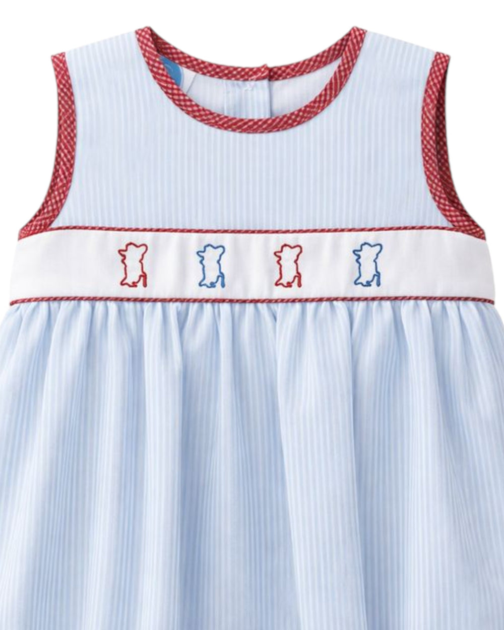 Children's dress with red trim and embroidered bears on a white background
