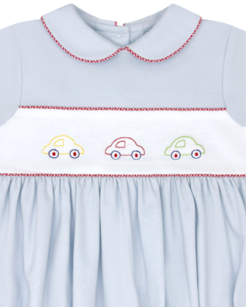Light blue dress with embroidered cars on a white background