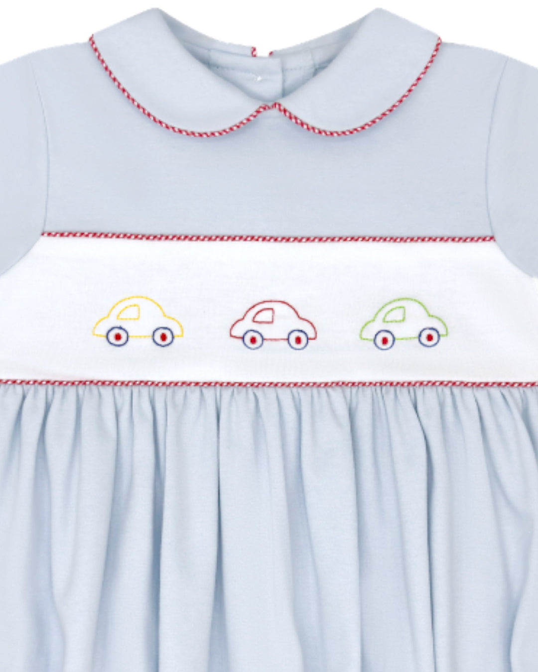 Light blue dress with embroidered cars on a white background