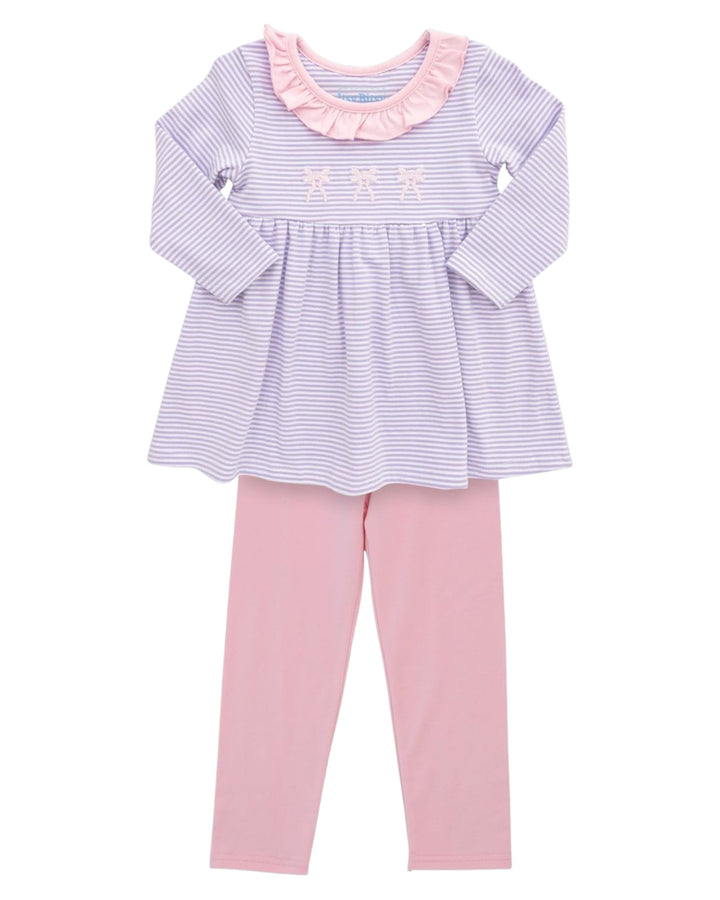 Children's outfit with striped top and pink pants on a white background