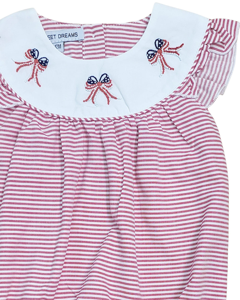 Red and white striped dress with embroidered bows on a white background, that store
