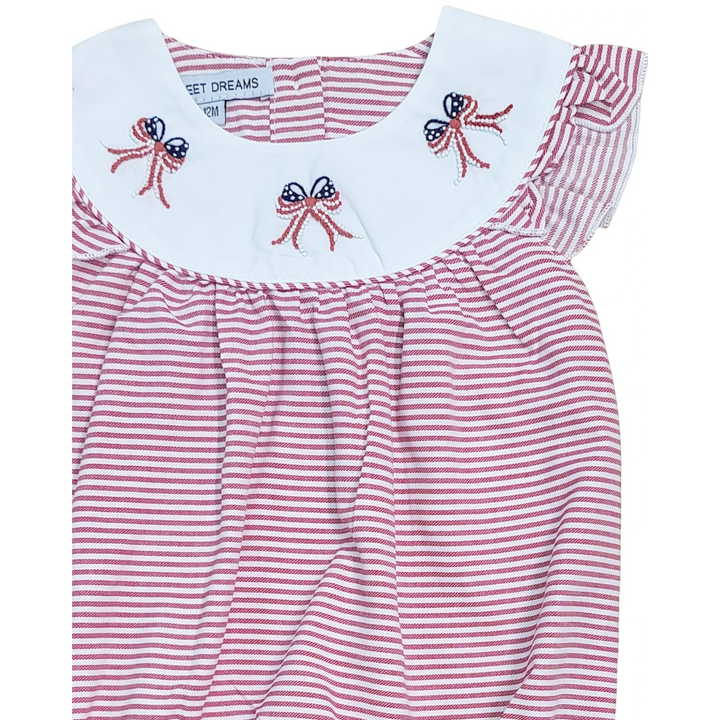 Red and white striped dress with embroidered bows on a white background, that store