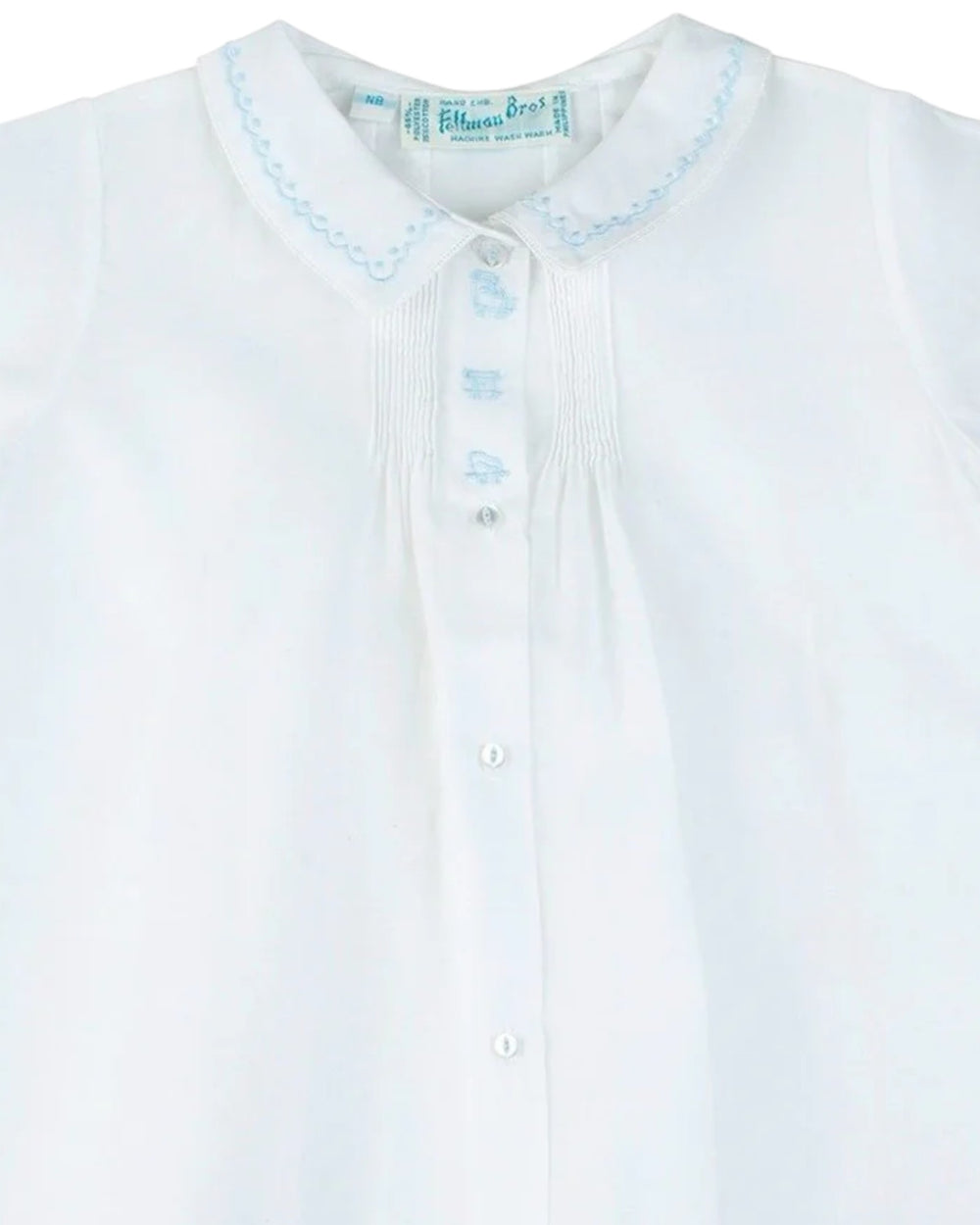 White shirt with blue embroidery on a white background