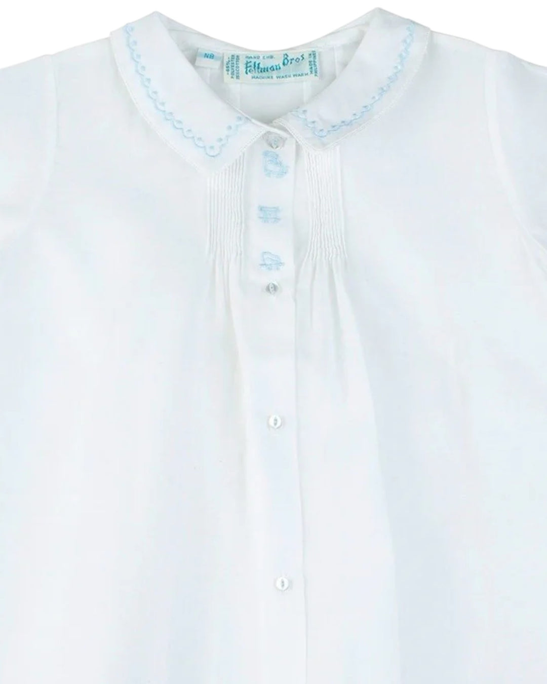 White shirt with blue embroidery on a white background