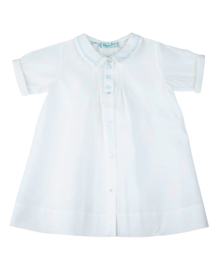 White dress shirt with blue trim on a white background