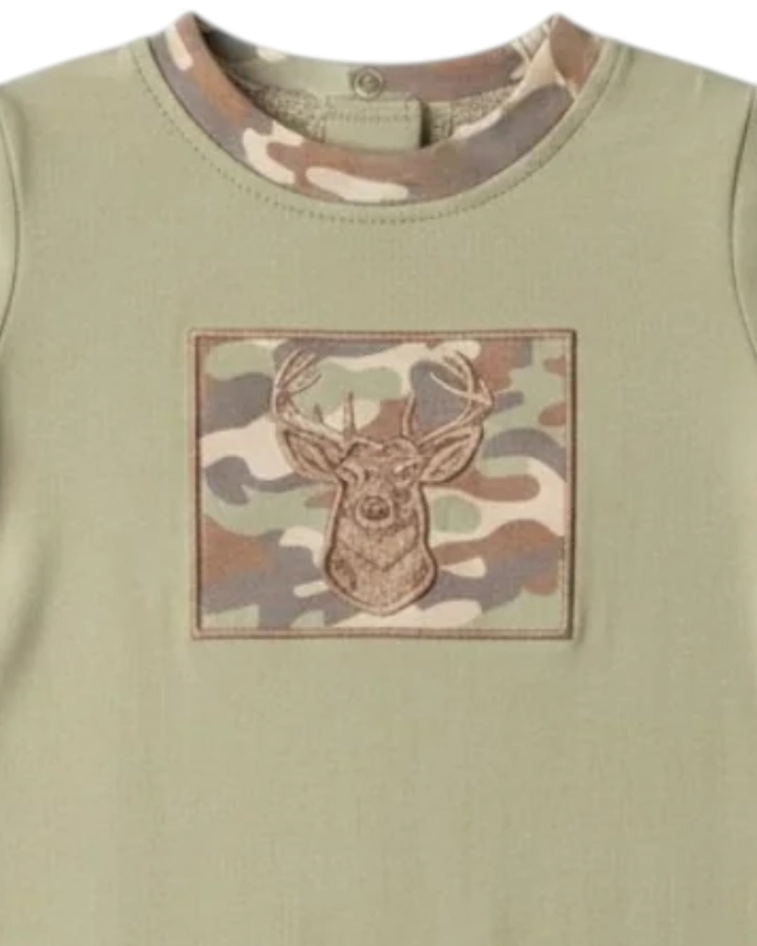 A close-up of a sage green long-sleeve shirt featuring a square camouflage patch on the chest with an embroidered deer head motif, that store