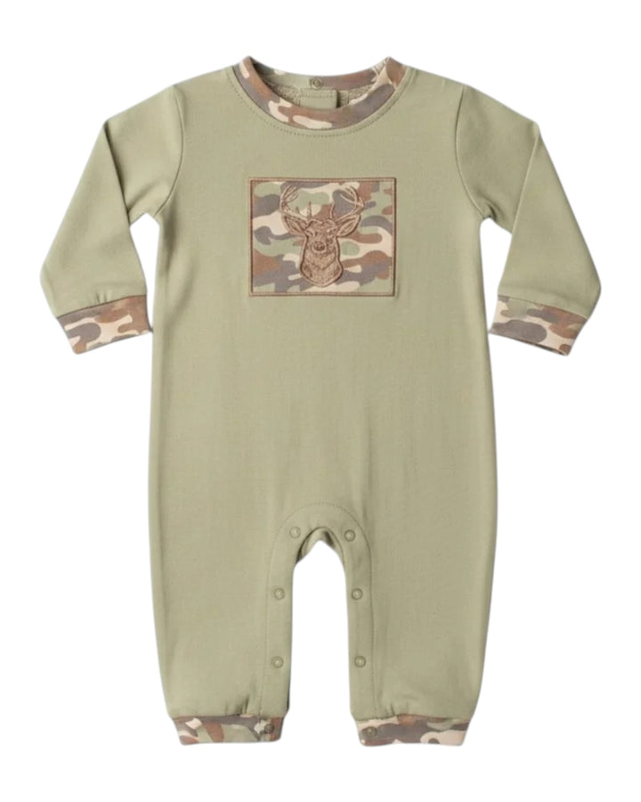 A sage green long-sleeve baby romper with camouflage trim on the collar, cuffs, and hems, featuring a square chest graphic of a deer head on a camouflage background, that store