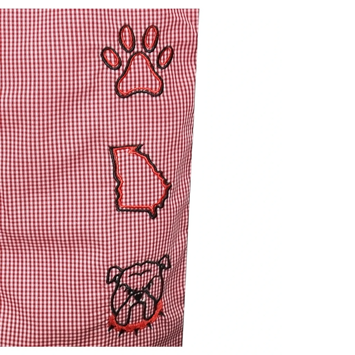 Red checkered fabric with paw print, state outline, and bulldog head designs.