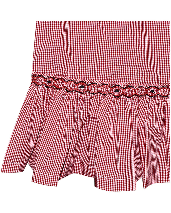 Red and white checkered shorts with a decorative waistband on a white background