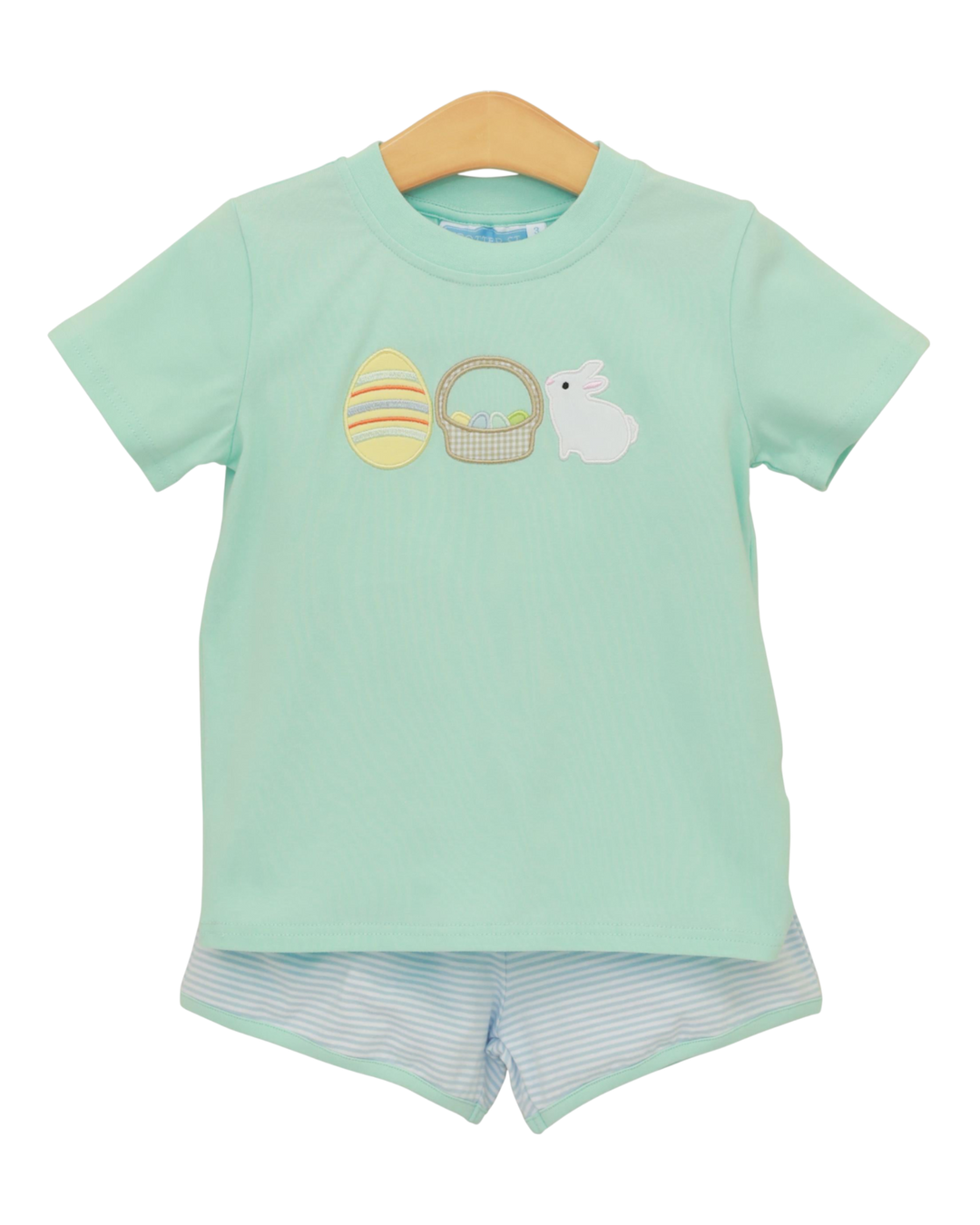 Light green t-shirt with Easter design and matching shorts on a hanger against a white background