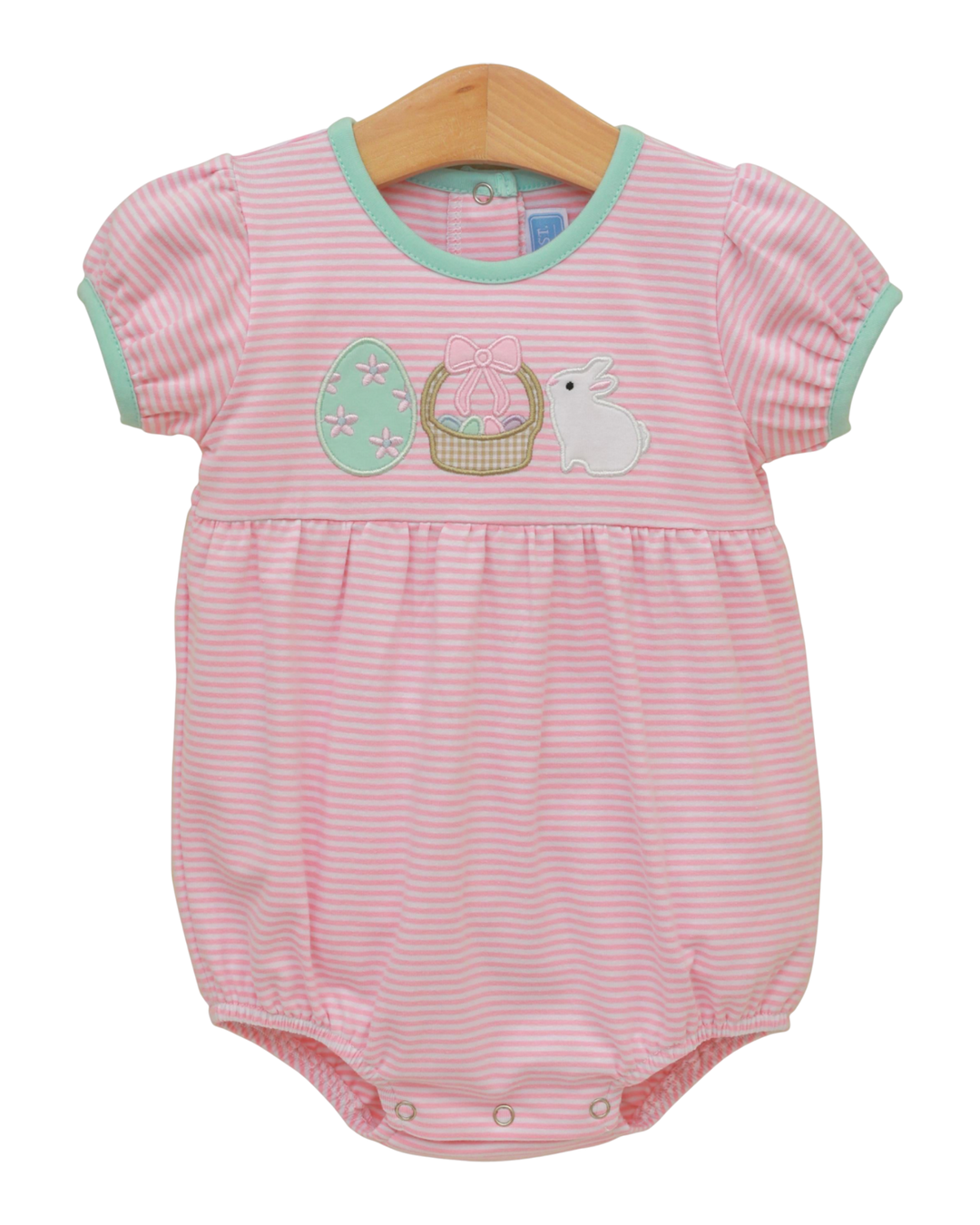 Pink striped baby romper with Easter design on a wooden hanger