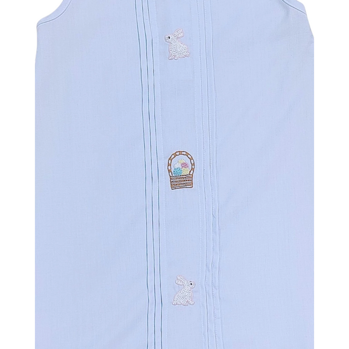 Light blue sleeveless garment with embroidered designs on a white background