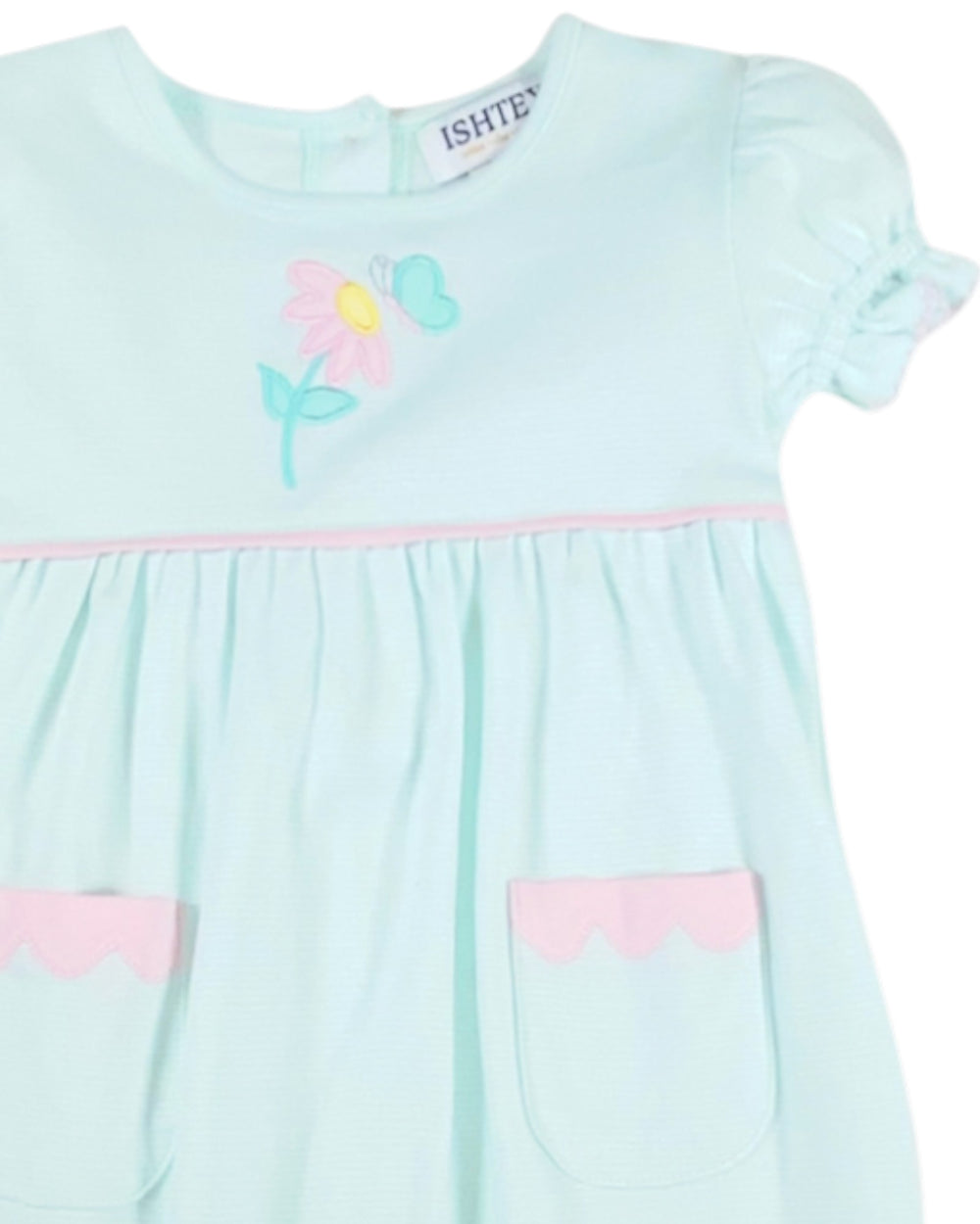 Light blue dress with pink accents and a flower design on a white background