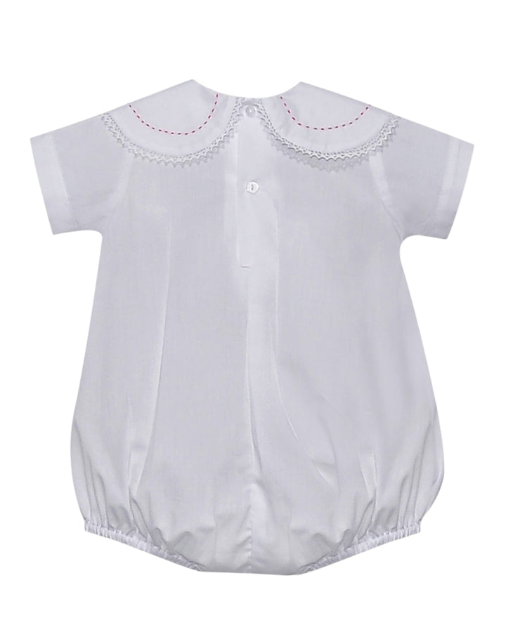 White baby romper with embroidered details on a white background