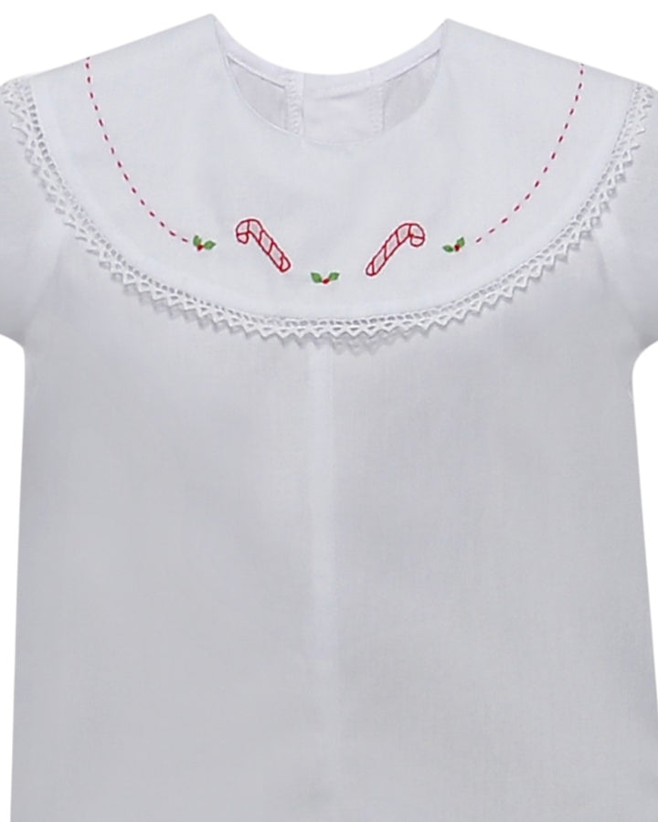 White shirt with red candy cane embroidery on a white background